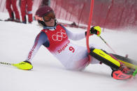 FILE - Mikaela Shiffrin of the United States crashes out during the women's combined slalom at the 2022 Winter Olympics, Thursday, Feb. 17, 2022, in the Yanqing district of Beijing. Shiffrin isn't putting the same pressure on herself for the upcoming world championships, starting on on Feb. 6, 2023 in Courchevel and Meribel, France, that she did for last year's Beijing Olympics. The event is Shiffrin's first major championship since American skier didn't win a medal and didn't finish three of her five races at the Olympics. (AP Photo/Robert F. Bukaty, File)