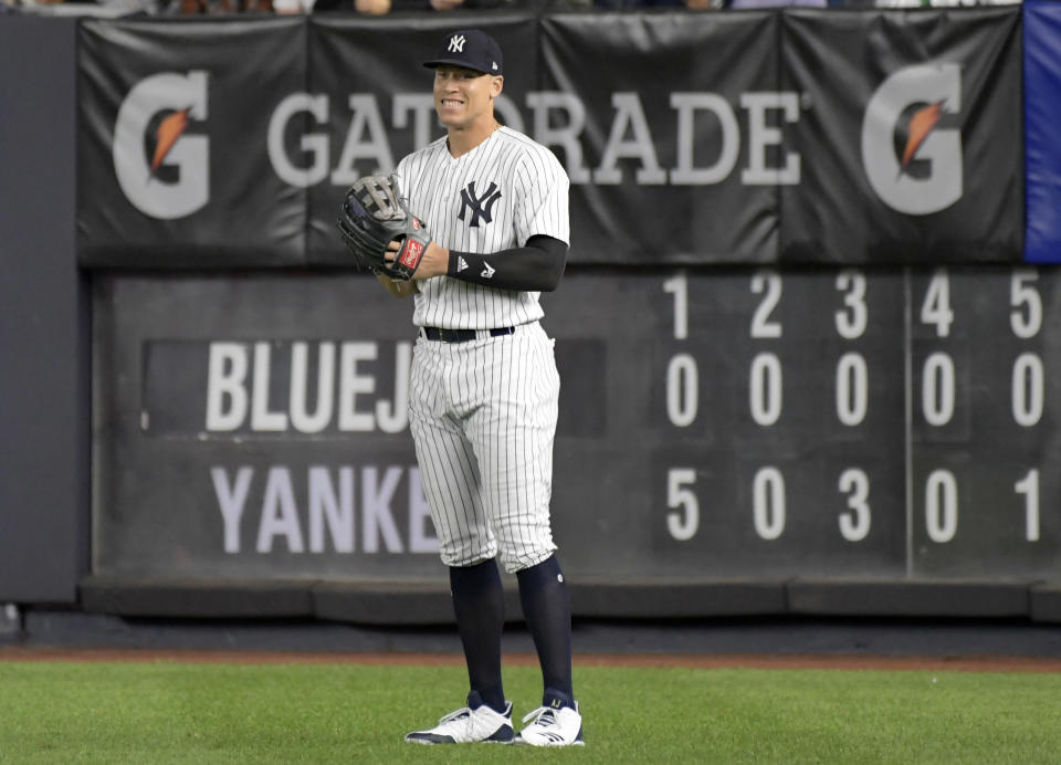 New York Yankees right fielder Aaron Judge smiles after coming into the baseball game in the eighth inning against the Toronto Blue Jays Friday, Sept.14, 2018, at Yankee Stadium in New York. (AP Photo/Bill Kostroun)