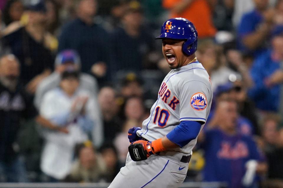 New York Mets' Eduardo Escobar reacts after hitting a two-RBI triple during the ninth inning of a baseball game against the San Diego Padres, Monday, June 6, 2022, in San Diego. (AP Photo/Gregory Bull)