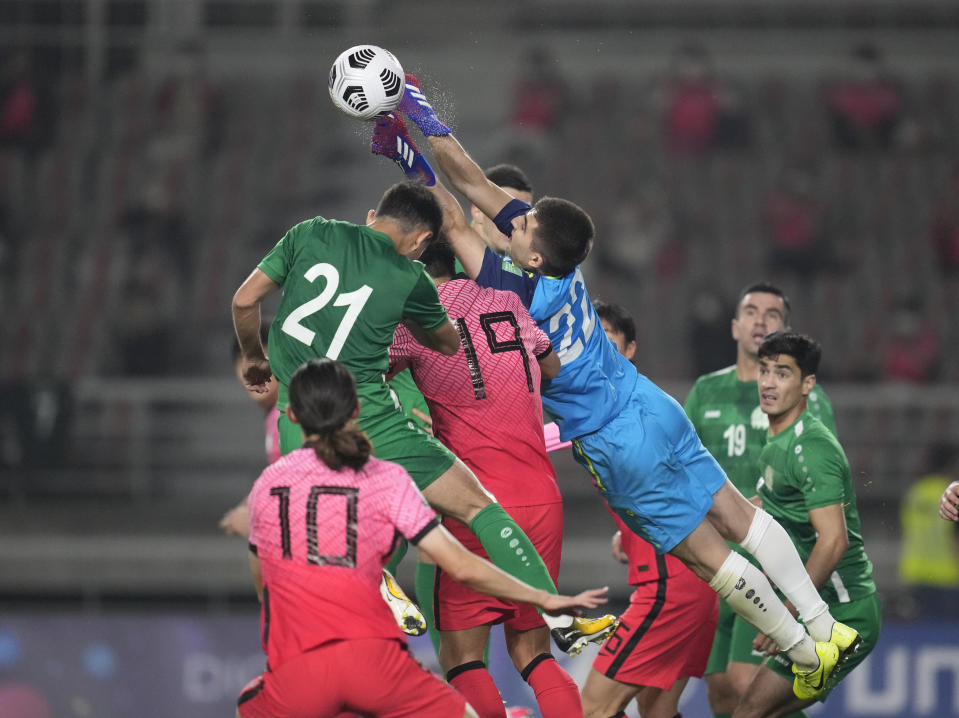 Turkmenistan's goalkeeper Charyyev Rasul punches the ball during their Asian zone Group H qualifying soccer match against South Korea for the FIFA World Cup Qatar 2022 at Goyang stadium in Goyang, South Korea, Saturday, June 5, 2021. (AP Photo/Lee Jin-man)