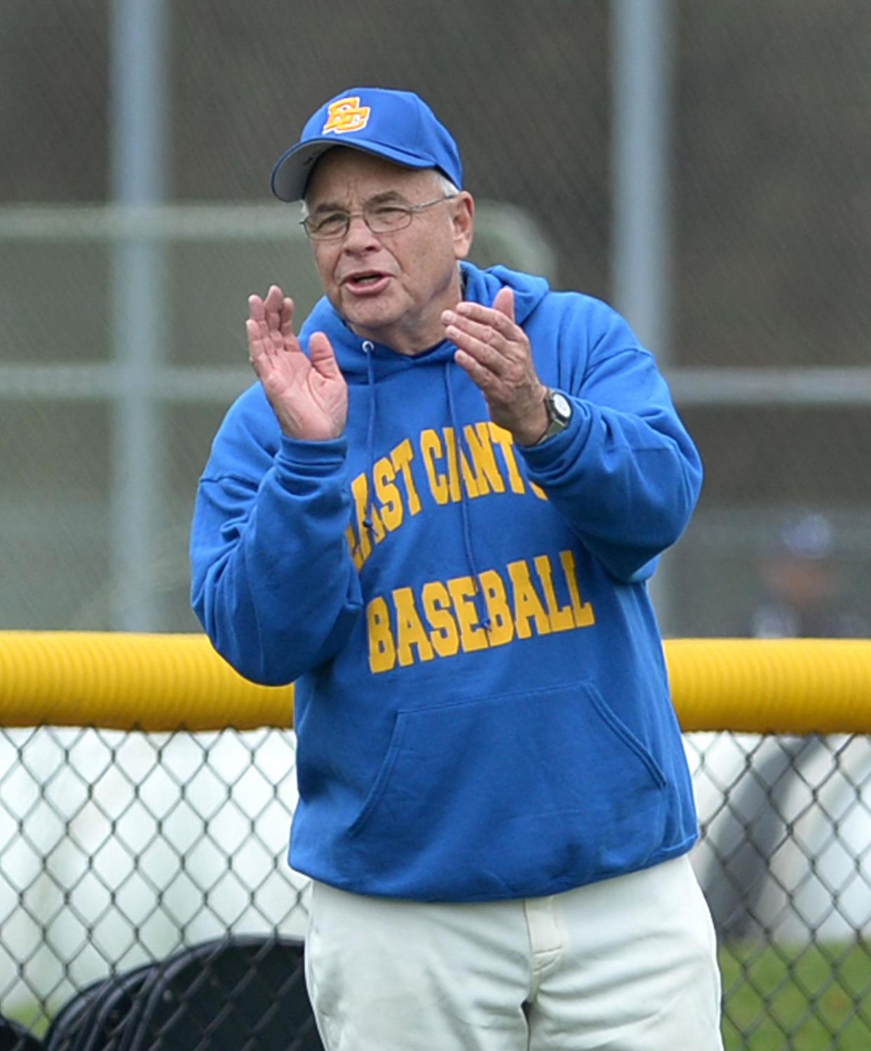 East Canton baseball coach Doug Miller encourages his team during a 2019 game.