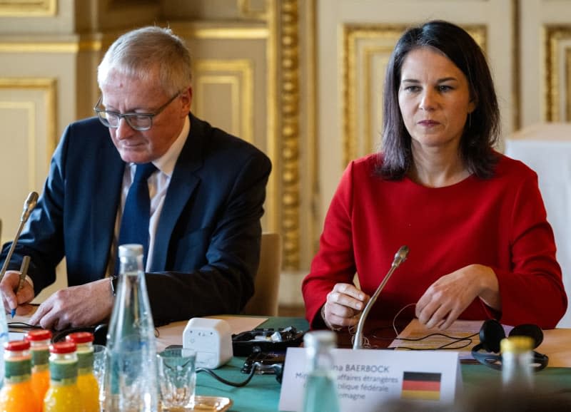 German Foreign Minister Annalena Baerbock and German Ambassador Stephan Steinlein (L) attend a meeting with French Foreign Minister Stephane Sejourne (Not Pictured). Soeren Stache/dpa