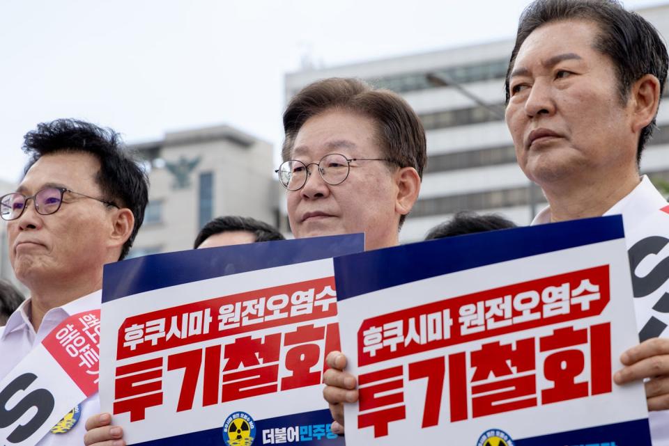 Lee Jae-myung, center, leader of the main opposition Democratic Party, holds a banner during a rally opposing Japan’s discharge of treated radioactive water into the ocean on Aug. 25, 2023, in Seoul, South Korea. <a href="https://www.gettyimages.com/detail/news-photo/lee-jae-myung-leader-of-the-main-opposition-democratic-news-photo/1622143449?adppopup=true" rel="nofollow noopener" target="_blank" data-ylk="slk:Chris Jung/NurPhoto via Getty Images;elm:context_link;itc:0;sec:content-canvas" class="link ">Chris Jung/NurPhoto via Getty Images</a>