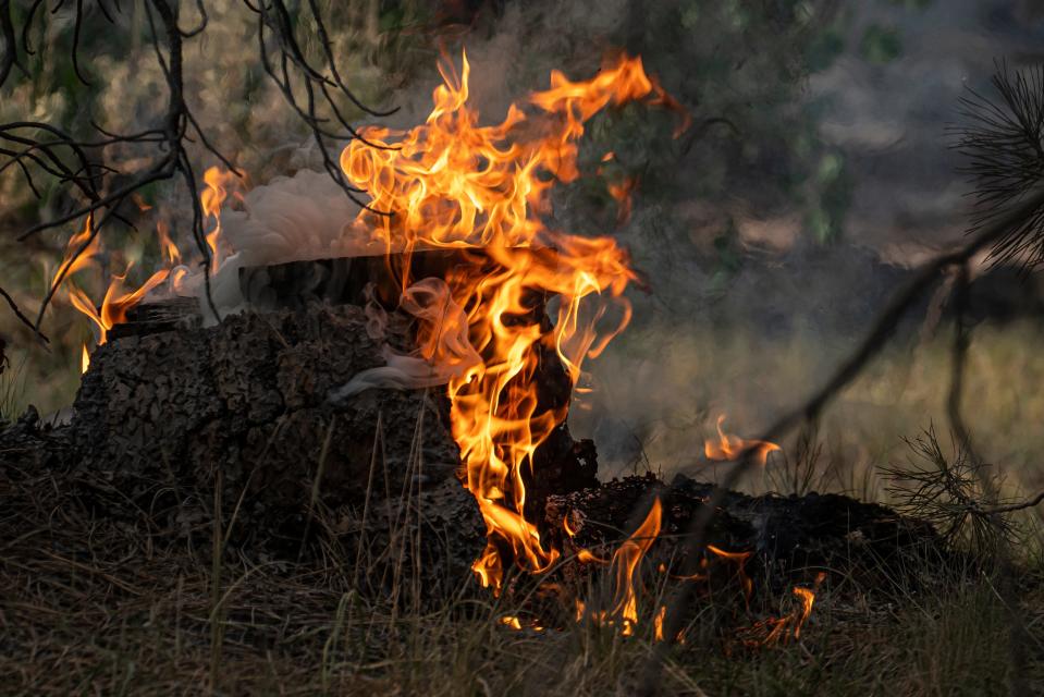 Spot fires burn on July 22, 2021, in Paisley, Ore.