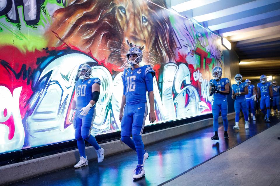 Detroit Lions quarterback Jared Goff (16) and guard Graham Glasgow (60) walk down the tunnel before the game against Atlanta Falcons at Ford Field in Detroit on Sunday, Sept. 24, 2023.