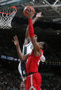 Michigan State's Aaron Henry, rear, blocks a shot by Ohio State's Andre Wesson during the first half of an NCAA college basketball game, Sunday, March 8, 2020, in East Lansing, Mich. (AP Photo/Al Goldis)