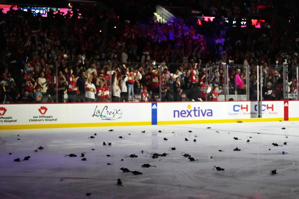 Jun 8, 2023; Sunrise, Florida, USA; Toy rats are seen on the ice as Florida Panthers fans celebrate the overtime victory against the Vegas Golden Knights in game three of the 2023 Stanley Cup Final at FLA Live Arena. Mandatory Credit: Jasen Vinlove-USA TODAY Sports