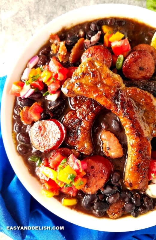 <p>Easy and Delish</p><p>Feijoada is Brazil’s national dish! It consists of a humble yet richly flavorful black bean and pork stew cooked low and slow. This version features instructions on how to make feijoada 3 ways: on the stovetop, in the slow cooker, and in the pressure cooker.</p><p><strong>Get the Recipe: <a href="https://www.easyanddelish.com/feijoada-black-bean-stew/" rel="nofollow noopener" target="_blank" data-ylk="slk:Feijoada Recipe;elm:context_link;itc:0;sec:content-canvas" class="link ">Feijoada Recipe</a></strong></p>