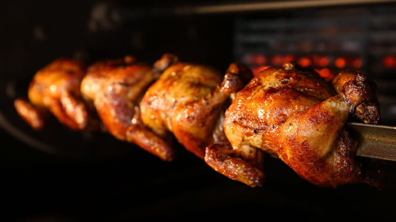 Rotisserie chicken in the middle of baking