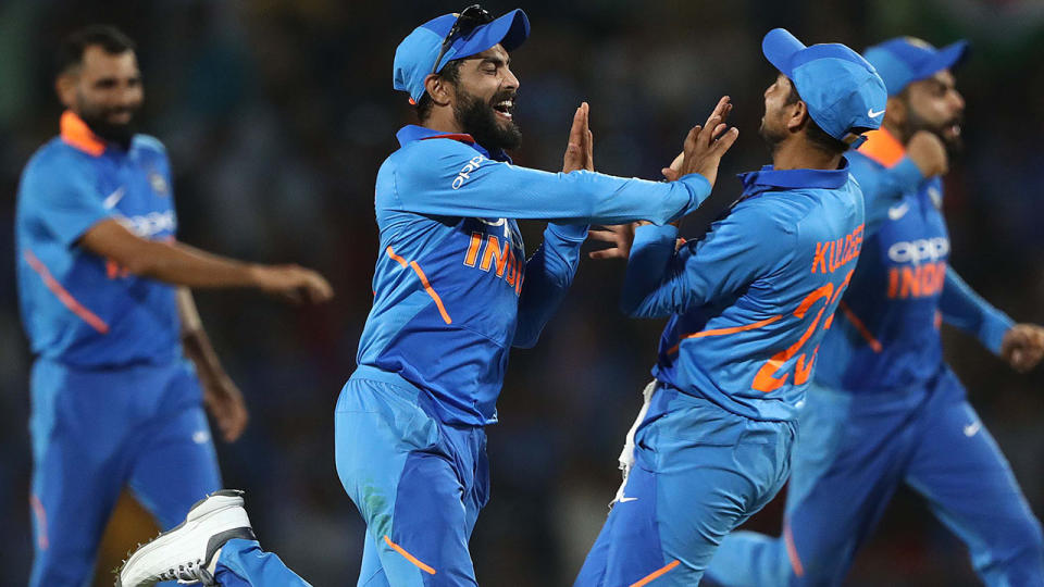 Ravindra Jadeja celebrates after he ran out Peter Handscomb. (Photo by Robert Cianflone/Getty Images)