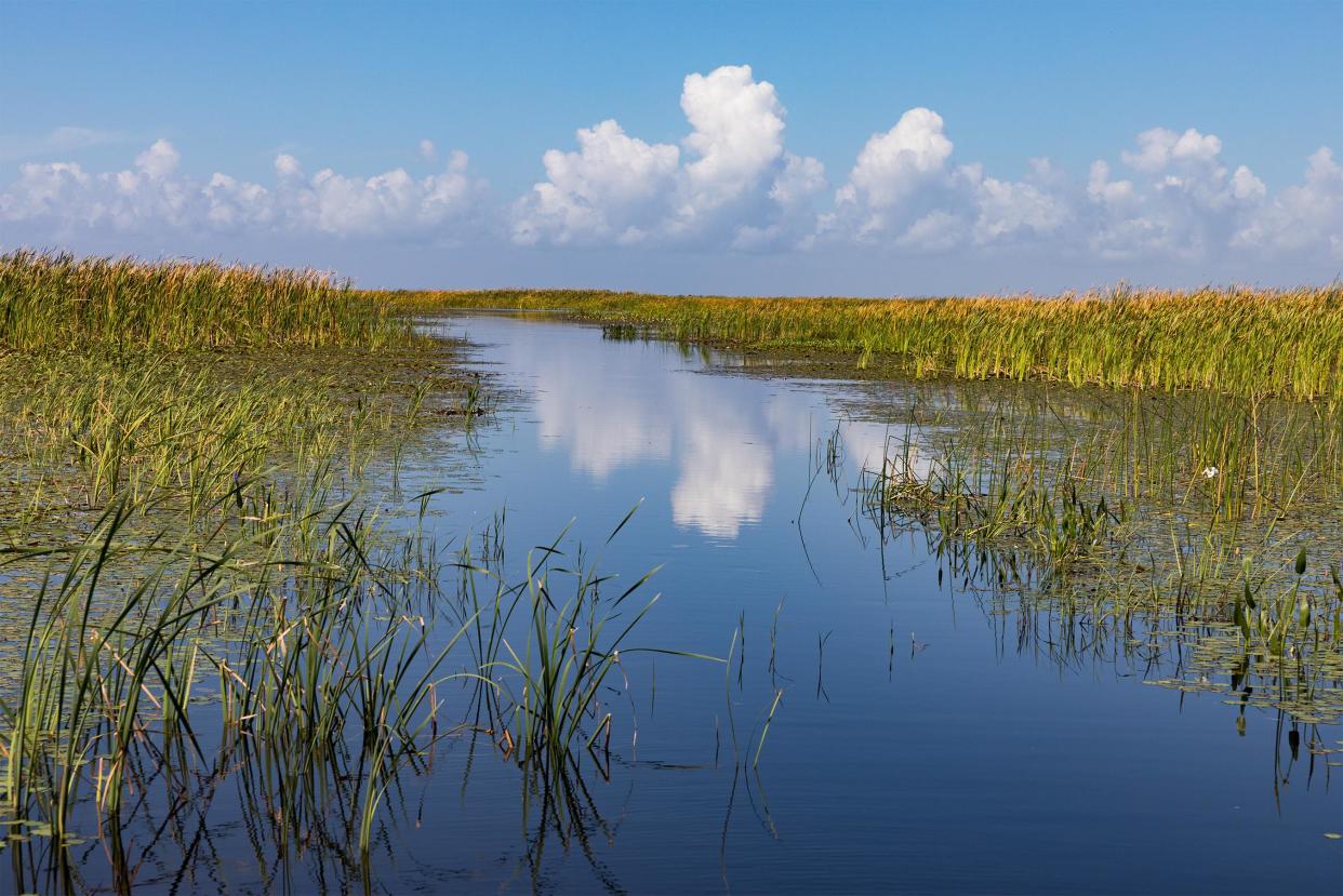 Clouds are reflected in the waters of Lake Okeechobee in 2018.