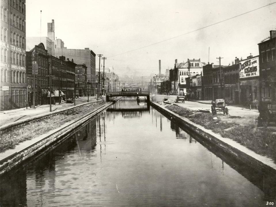 The view east from Race Street on September 29, 1903, of the old Miami and Erie Canal, now route of Central Parkway. Courtesy of The Cincinnati Historical Society