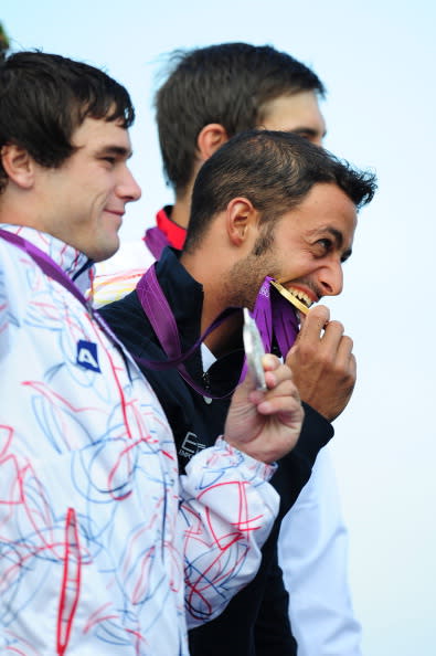 Daniele Molmenti (C) of Italy celebrates winning the gold medal with silver medalist Vavrinec Hradilek of Czech Republic and bronze medalist Hannes Aigner of Germany after the Men's Kayak Single (K1) Final on Day 5 of the London 2012 Olympic Games at Lee Valley White Water Centre on August 1, 2012 in London, England. (Photo by Stu Forster/Getty Images)