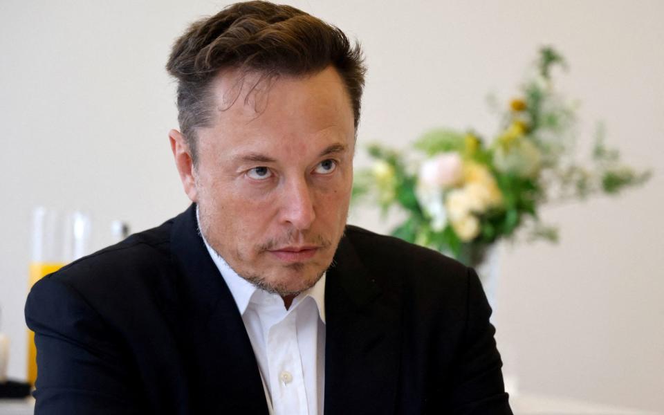 FILE PHOTO: Electric car maker Tesla CEO Elon Musk meets with French Minister for the Economy and Finances Bruno Le Maire on the sidelines of the 6th edition of the "Choose France" Summit at the Chateau de Versailles, outside Paris on May 15, 2023. LUDOVIC MARIN/Pool via REUTERS/File Photo - LUDOVIC MARIN/Pool via REUTERS/File Photo