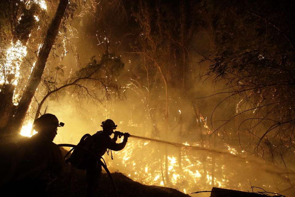 Firefighters battle the Maria Fire Friday, Nov. 1, 2019, in Somis, Calif. (AP Photo/Marcio Jose Sanchez)