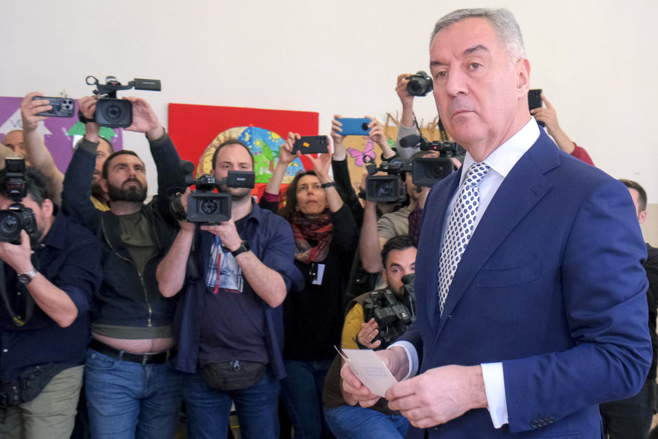 Pro-Western incumbent Milo Djukanovic prepares to vote at a polling station in Montenegro's capital Podgorica, Sunday, April 2, 2023. Montenegrins are casting ballots on Sunday in a runoff presidential election that is a battle between a long-serving pro-Western incumbent and a newcomer promising changes in the small NATO member state in Europe that has been locked in political turmoil. (AP Photo/Risto Bozovic)