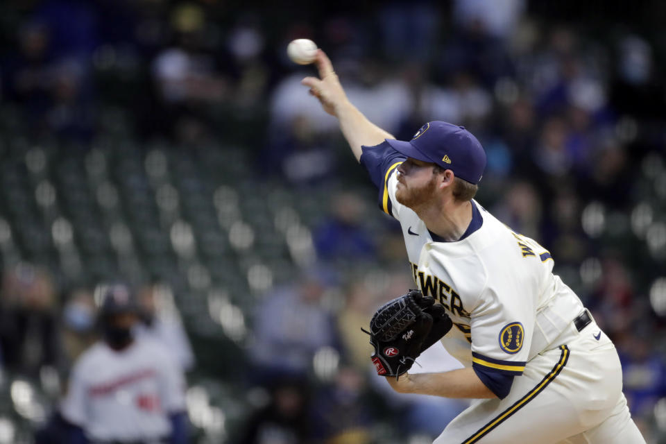 Milwaukee Brewers' Brandon Woodruff pitches during the first inning of an Opening Day baseball game against the Minnesota Twins Thursday, April 1, 2021, in Milwaukee. (AP Photo/Aaron Gash)