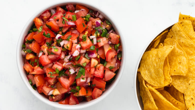 Salsa and tortilla chips in bowls