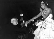 FILE - Charlie Chaplin congratulates entertainer Josephine Baker after her performance at the charity gala "Le Bal des Petits Lits Blancs," at the Moulin Rouge in Paris, on May 20, 1953. France is inducting Josephine Baker – Missouri-born cabaret dancer, French Resistance fighter and civil rights leader – into its Pantheon, the first Black woman honored in the final resting place of France's most revered luminaries. (AP Photo, File)