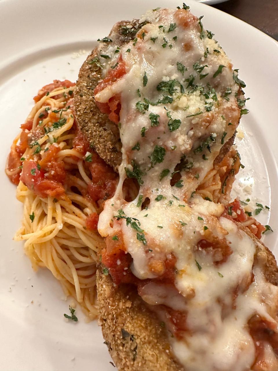 Eggplant parmesan, lightly breaded and sauteed, with a side of angel hair pasta, is among the entrees offered at the new Maisano's Little Italian Kitchen in Plain Township.