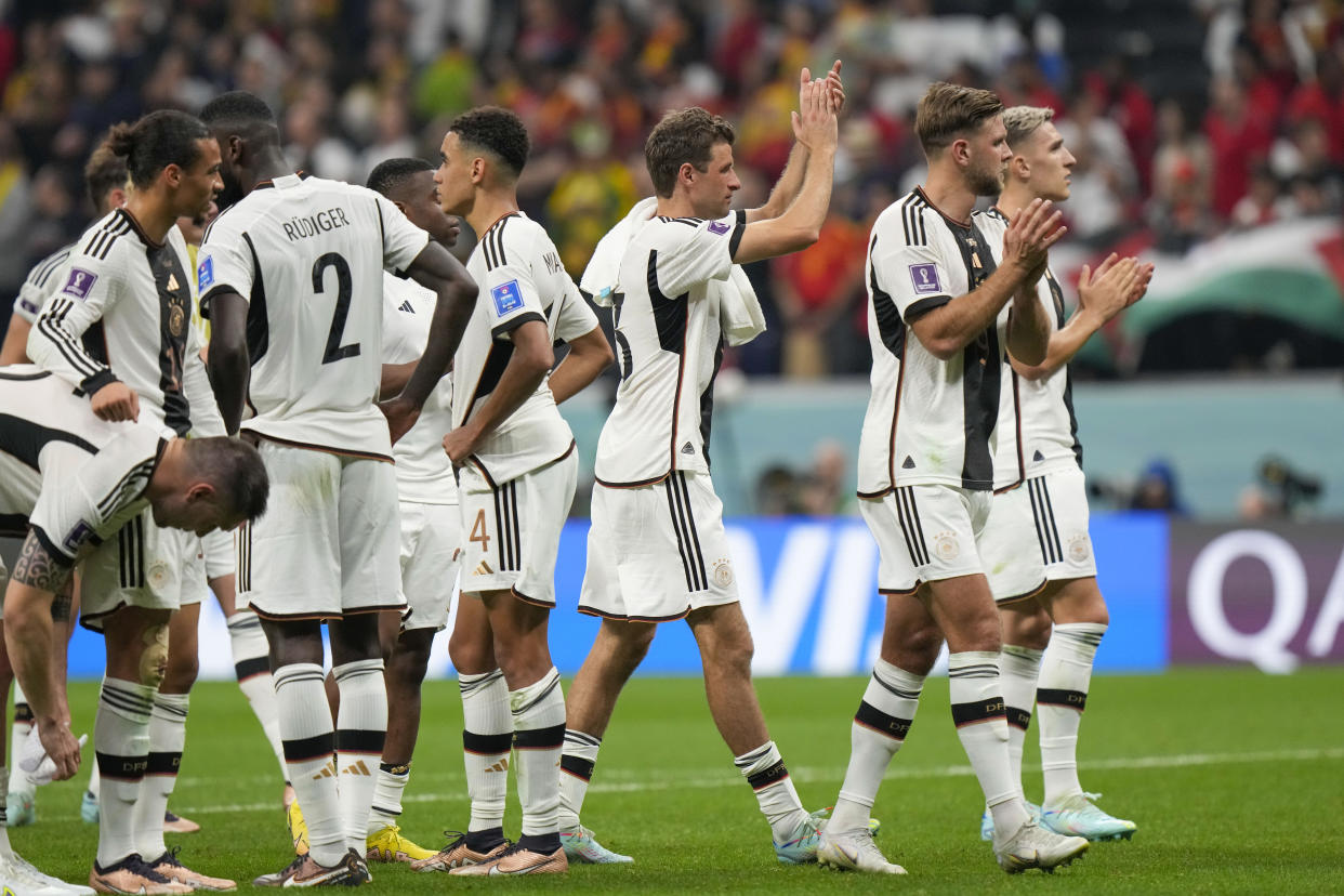 Germany players celebrate at the end of the World Cup group E soccer match between Spain and Germany, at the Al Bayt Stadium in Al Khor , Qatar, Sunday, Nov. 27, 2022. (AP Photo/Luca Bruno)