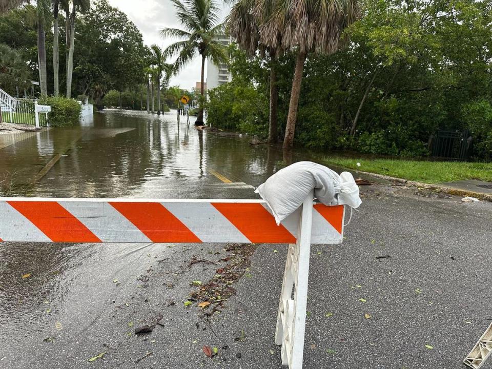 City of Bradenton workers closed parts of Virginia Drive along Wares Creek after Hurricane Idalia created flood waters making the road impassable on Wednesday, Aug. 30, 2023.