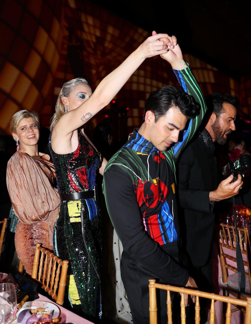 Robyn, Sophie Turner, and Joe Jonas inside the Met Gala on May 6, 2019.