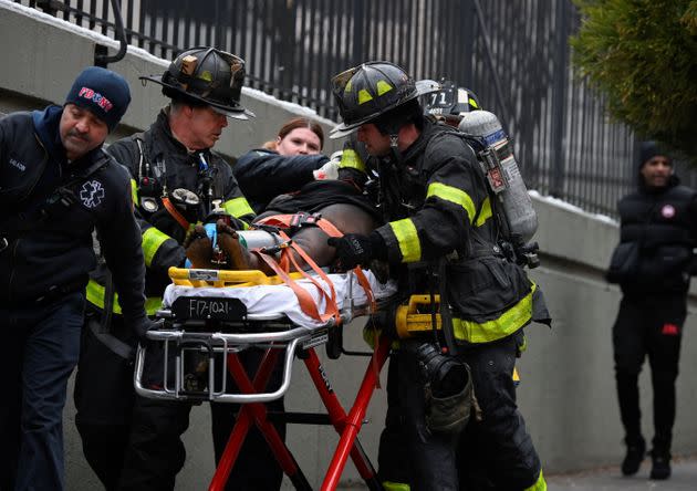 Medical aid is provided to a victim of a five-alarm fire in New York City on Sunday. The fire was one of the city's worst in modern times. (Photo: Lloyd Mitchell via Reuters)