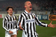 FILE - Juventus striker Gianluca Vialli, right, celebrates after scoring as his teammate Michele Padovano looks on, during the Champions League, semifinal, 1st-leg match between Juventus abd Nantes, at the Turin Delle Alpi stadium, Italy, on April 3, 1996. Gianluca Vialli, the former Italy striker who helped both Sampdoria and Juventus win Serie A and European trophies before becoming a player-manager at Chelsea, has died on Friday, Jan. 6, 2023. He was 58. (AP Photo/Mauro Pilone, File)
