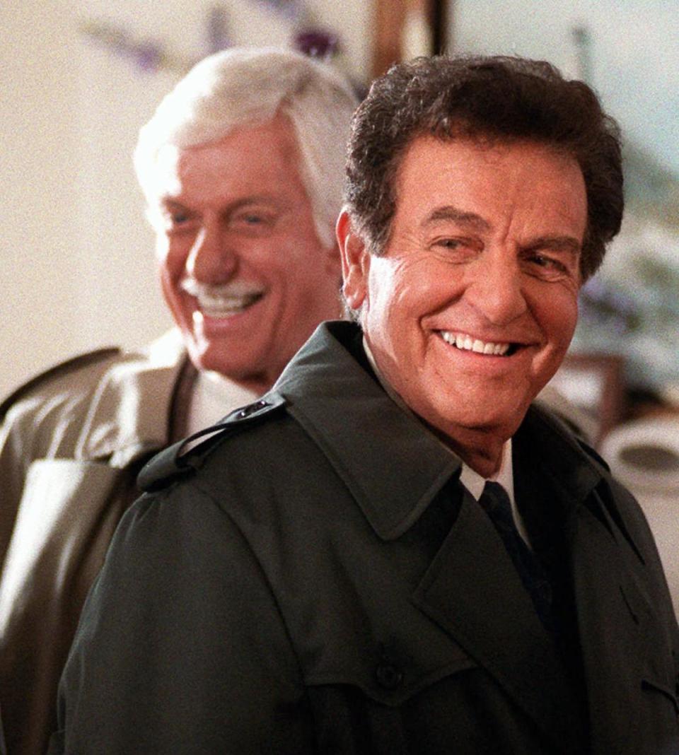 FILE - This Jan. 15, 1997 file photo, actor Mike Connors, right, appears with actor Dick Van Dyke during an episode of the television show "Diagnosis Murder," in Los Angeles. Connors, who played a hard-hitting private eye on the long-running TV series "Mannix," has died at age 91. His son-in-law, Mike Condon, says the actor died Thursday afternoon, Jan. 26, 2017, at a Los Angeles hospital from recently-diagnosed leukemia. (AP Photo/Chris Pizzello, File)