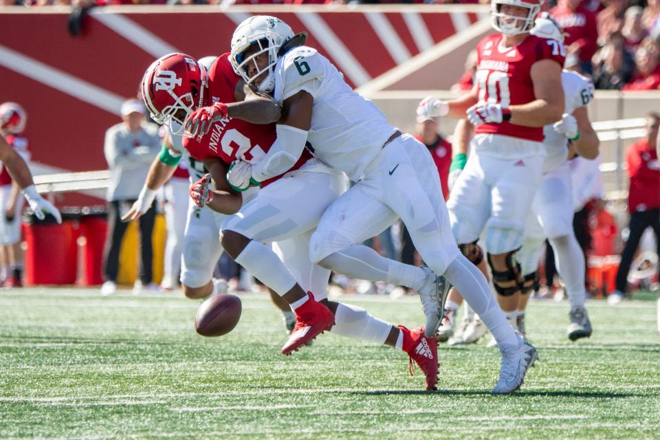 Indiana Hoosiers wide receiver Jacolby Hewitt (2) misses a pass under coverage from Michigan State Spartans linebacker Quavaris Crouch (6) during the first quarter Oct. 16, 2021 at Memorial Stadium.