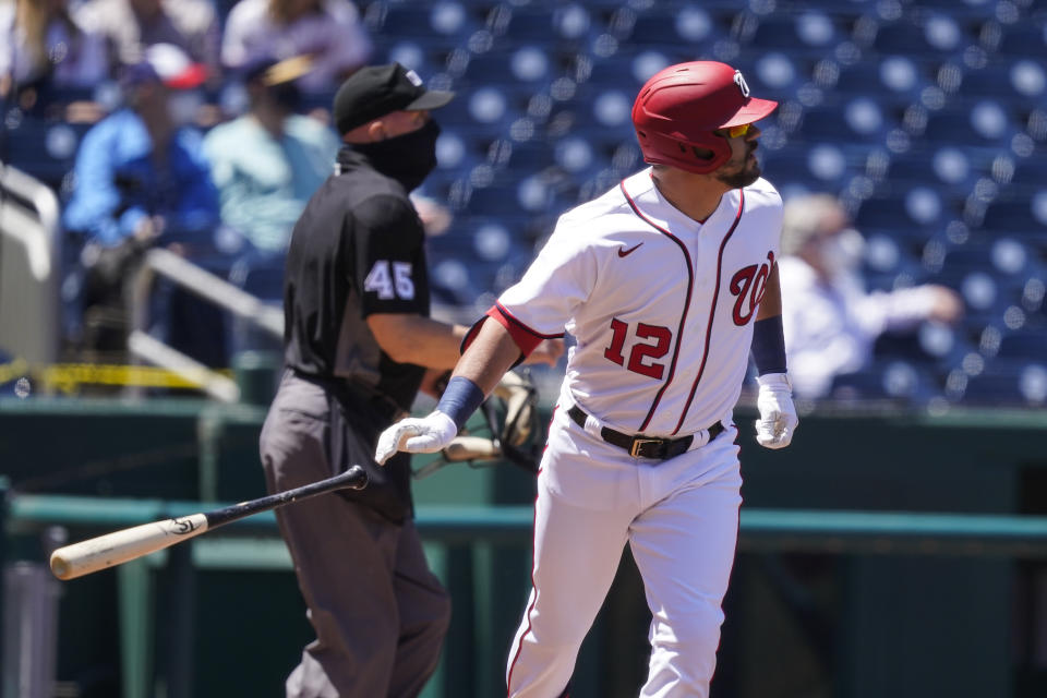 Washington Nationals' Kyle Schwarber watches his two-run homer during the first inning of a baseball game against the Philadelphia Phillies at Nationals Park, Thursday, May 13, 2021, in Washington. (AP Photo/Alex Brandon)