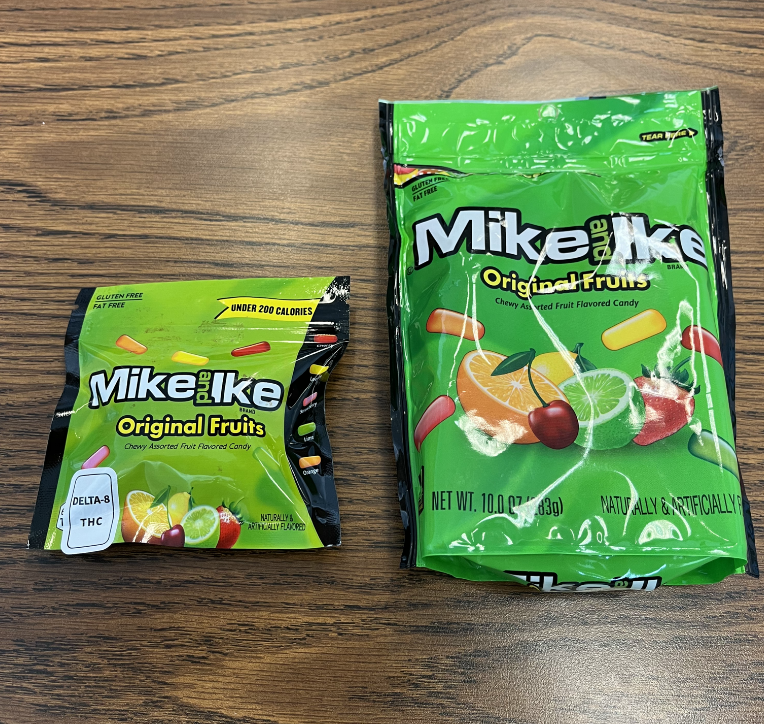 A package of marijuana-infused Mike and Ike candy, on the left, next to a regular package of Mike and Ike candy.