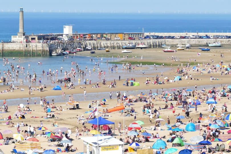 Beachgoers soak up the sunshine at Margate Main Sands