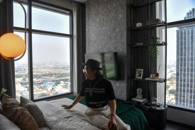 Daniel Bian, a Chinese potential property buyer from Shanghai, visits a luxury condominium in Bangkok