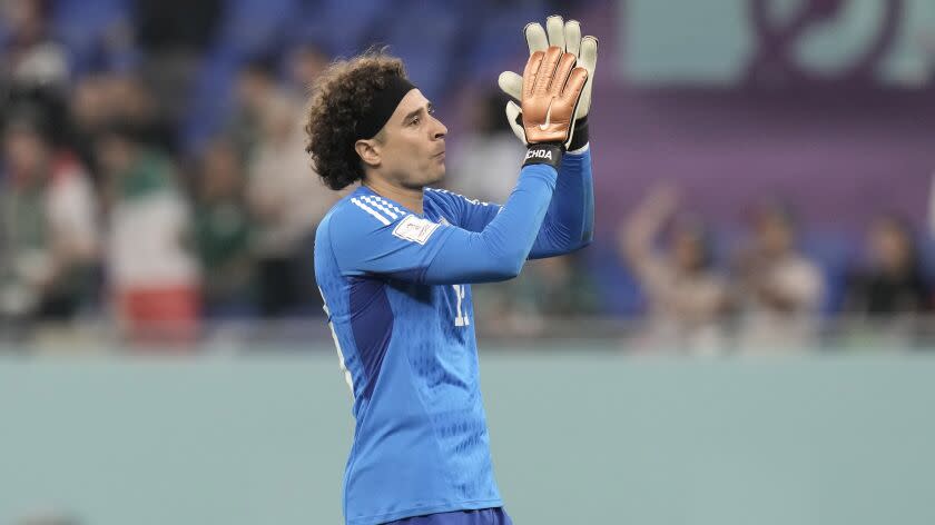 Mexico's goalkeeper Guillermo Ochoa acknowledges the supporters after the World Cup group C soccer match between Mexico and Poland, at the Stadium 974 in Doha, Qatar, Tuesday, Nov. 22, 2022. (AP Photo/Moises Castillo)