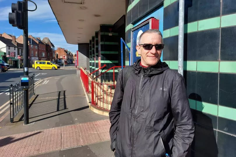 Nick Spencer (48) in front of the Beacon Bingo building