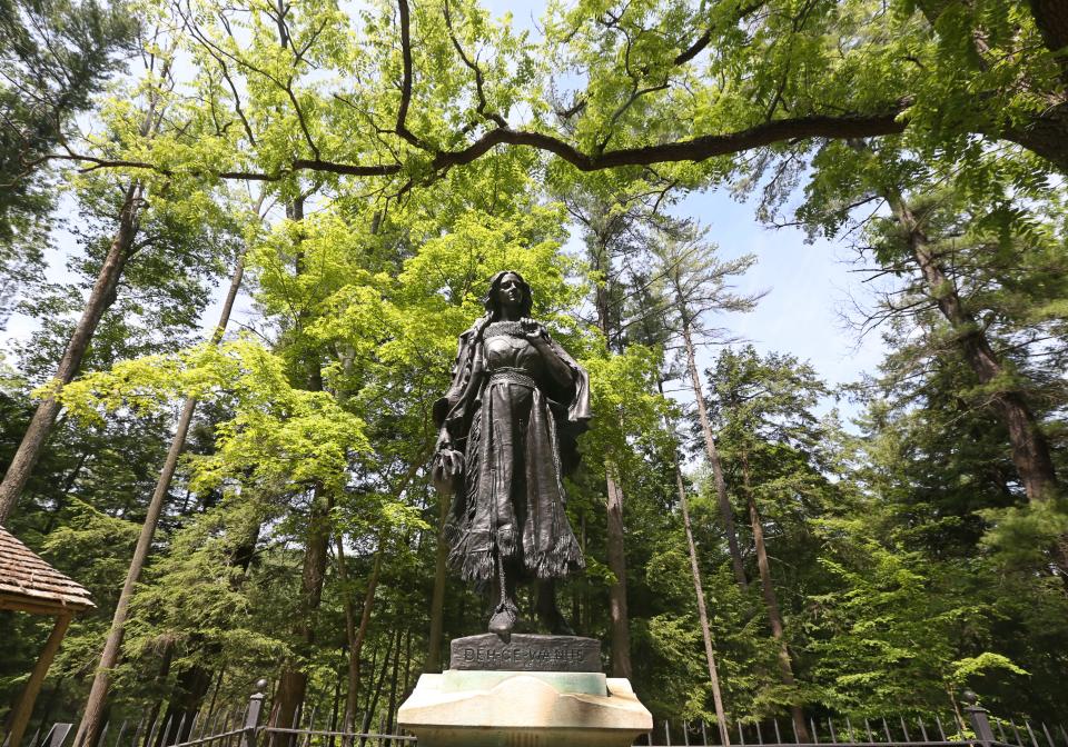 A statue honors, and marks the grave of Mary Jemison, located in the South End at Letchworth.