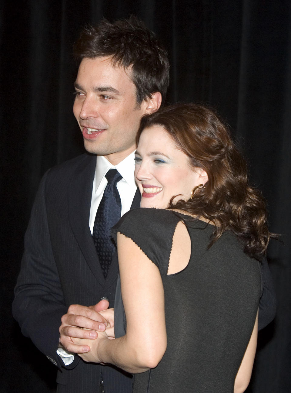 U.S. actors Jimmy Fallon and Drew Barrymore arrive at the 20th Century Fox ShoWest presentation and luncheon to promote their new movie "Fever Pitch" at the Paris Las Vegas hotel March 17, 2005, in Las Vegas, Nevada. ShoWest is the official convention of the National Association of Theatre Owners. REUTERS/Ethan Miller  EM/MA