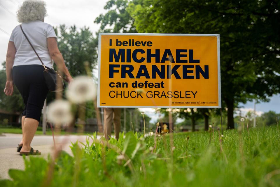 Campaign signs line the sidewalk outside the election night gathering for Democratic candidate for U.S. Senate Mike Franken, retired Navy admiral from Sioux City, on Tuesday, June 7, 2022, at Franklin Junior High, in Des Moines. 