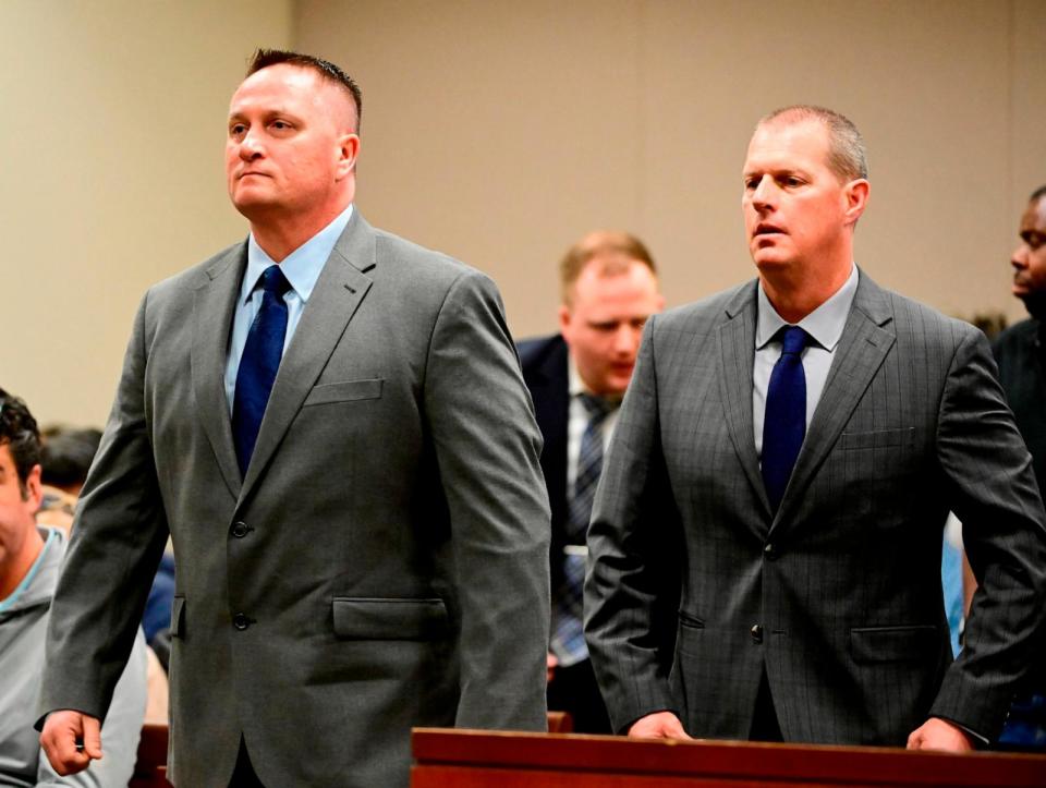 PHOTO: In this Jan. 20, 2023 file photo, Paramedics Jeremy Cooper, left, and Peter Cichuniec, right, at an arraignment in the Adams County district court at the Adams County Justice Center. (Andy Cross/MediaNews Group/The Denver Post via Getty Images, FILE)