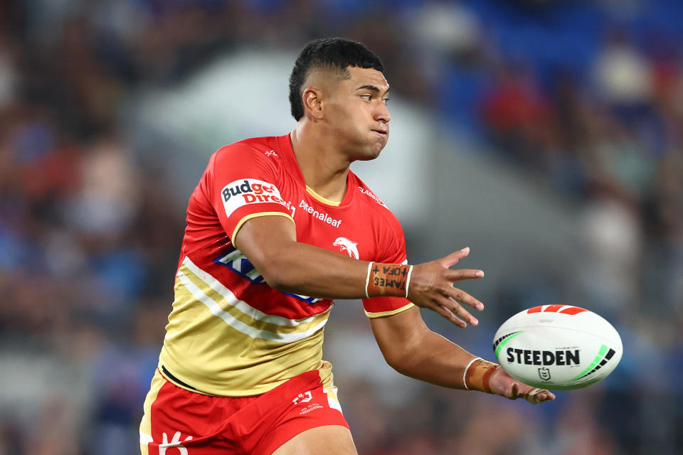 GOLD COAST, AUSTRALIA - MARCH 30: Isaiya Katoa of the Dolphins passes during the round four NRL match between Gold Coast Titans and Dolphins at Cbus Super Stadium, on March 30, 2024, in Gold Coast, Australia. (Photo by Chris Hyde/Getty Images)