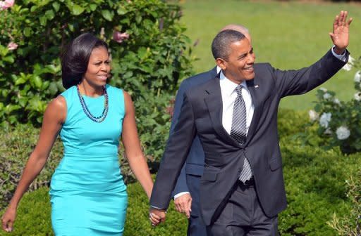 US President Barack Obama, First Lady Michelle Obama and Vice President Joe Biden arrive for a ceremony to honor the 2012 US Olympic and Paralympic teams on the South Lawn of the White House, September 14. Obama has carved out a clear advantage in the White House race even as he juggles the demands of his re-election campaign with managing a raging Middle East crisis