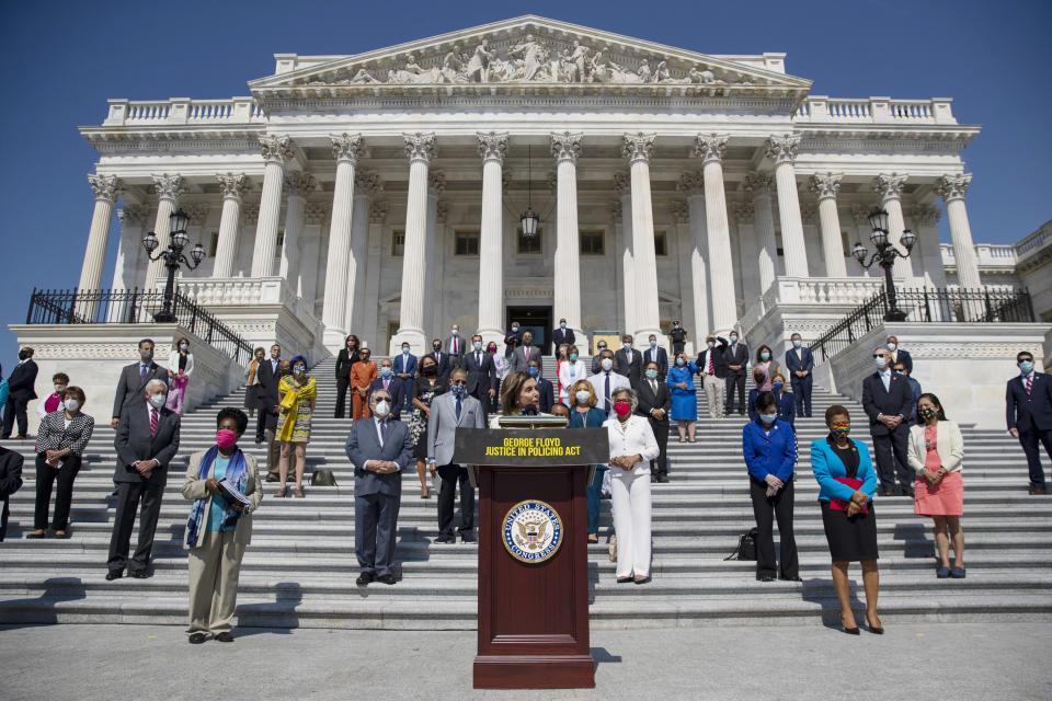 House Speaker Nancy Pelosi of Calif., joined by House Democrats spaced for social distancing, speaks during a news conference on the House East Front Steps on Capitol Hill in Washington, Thursday, June 25, 2020, ahead of the House vote on the George Floyd Justice in Policing Act of 2020. (AP Photo/Carolyn Kaster)