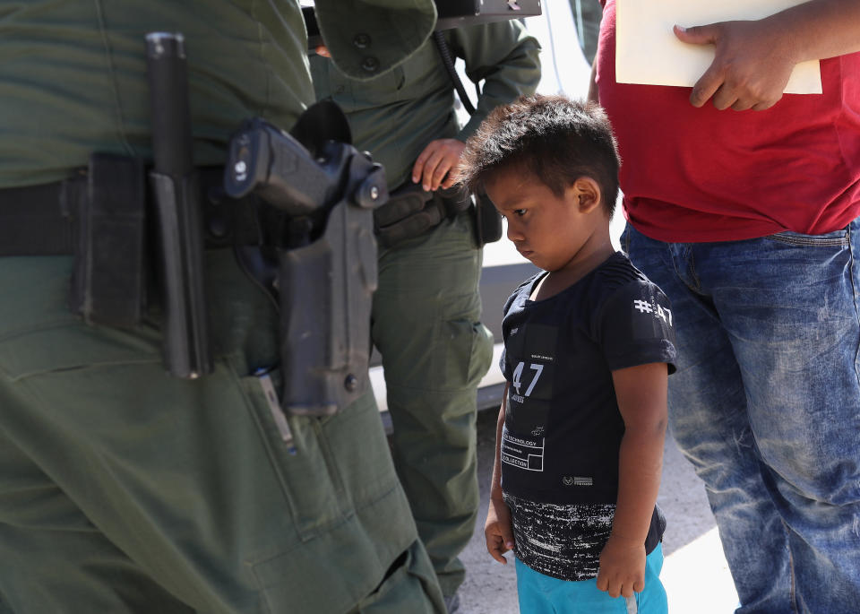 A boy and father from Honduras are taken into custody by U.S. Border Patrol agents near the U.S.-Mexico Border on June 12, 2018, near Mission, Texas. (Photo: John Moore via Getty Images)