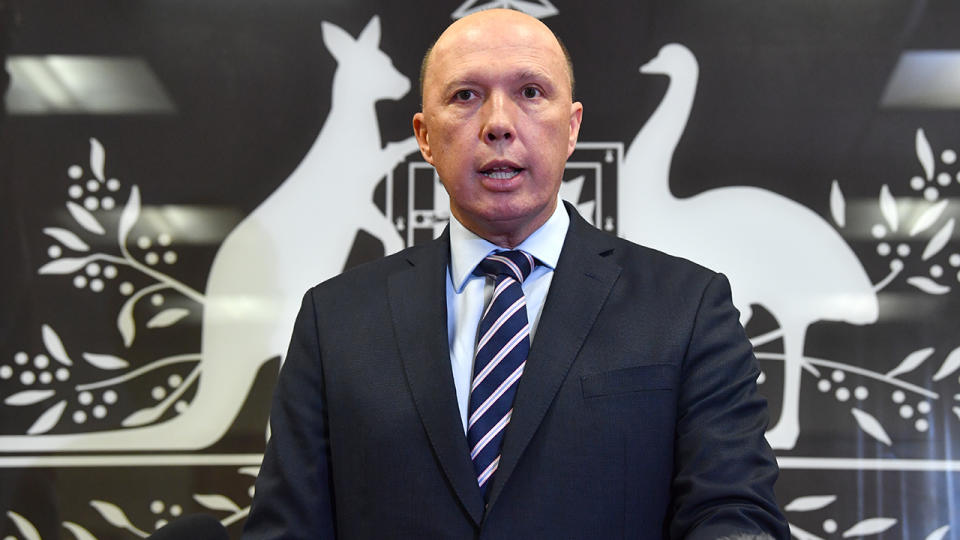 Photo shows Minister for Home Affairs Peter Dutton addressing the media.