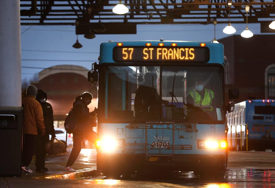 Passengers board a bus at the MATA William Hudson Transit Center in Uptown on Thursday, Feb. 4, 2021. 