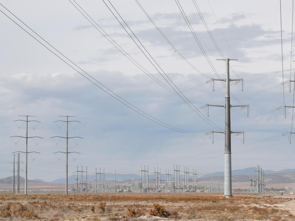 ELarge power lines bring power to a substation that powers a newly completed Facebook data center on October 5, 2021 in Eagle Mountain, Utah. - Copyright: George Frey/Getty Images