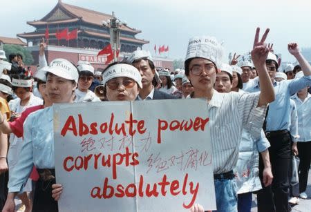 FILE PHOTO: A group of journalists supports the pro-Democracy protest in Tiananmen Square, Beijing, China May 17, 1989. REUTERS/Carl Ho/Files