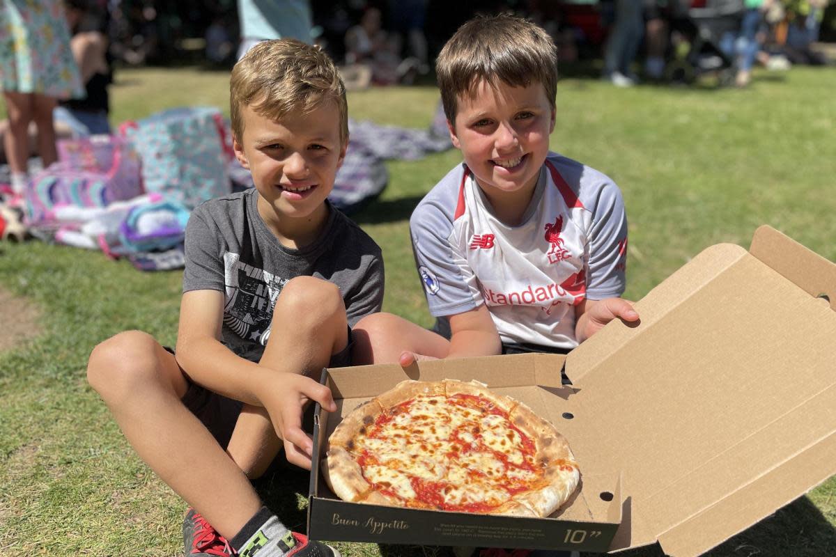 Harry and William Shepherd enjoying pizza at Malvern Food Festival last year <i>(Image: Malvern Hills District Council)</i>